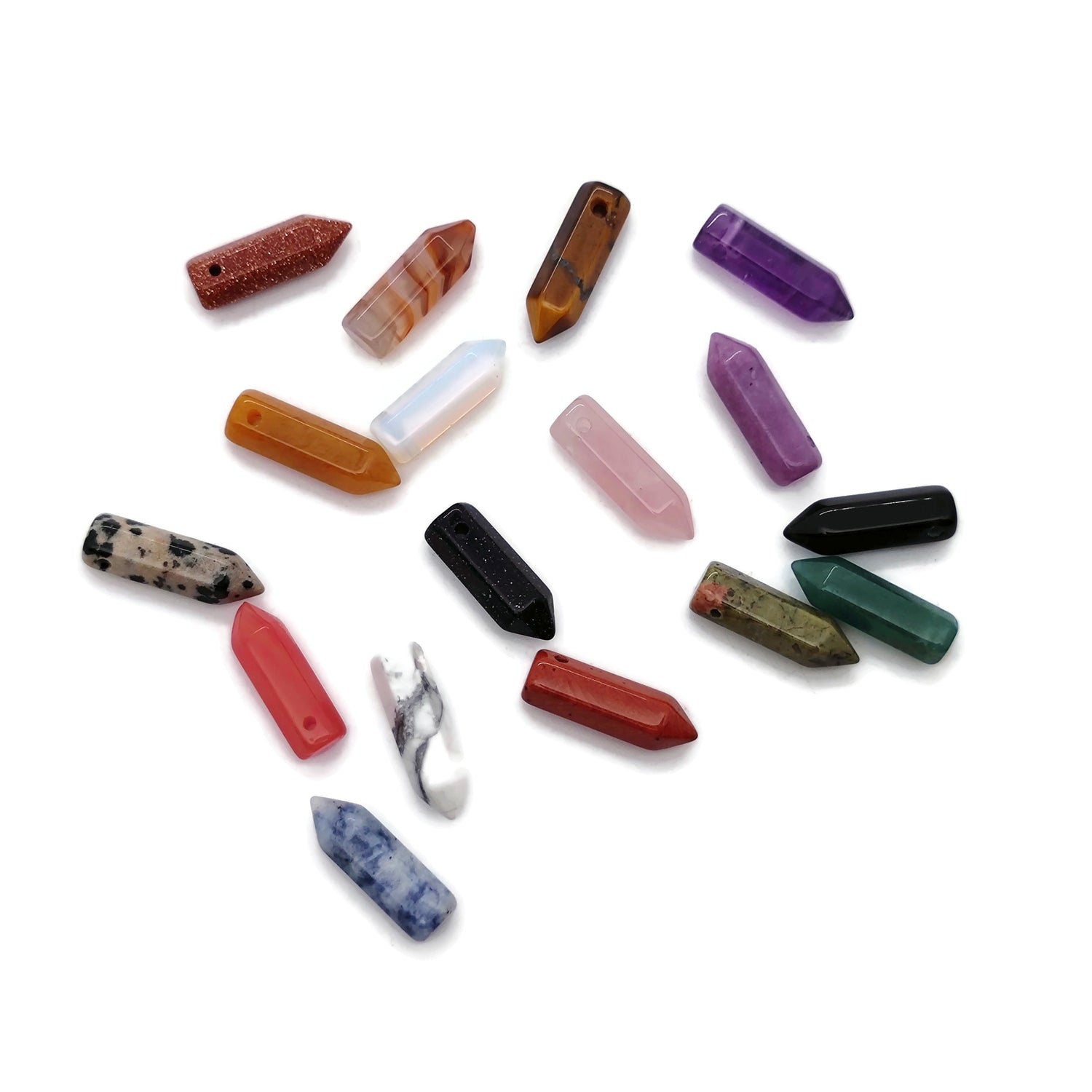 Drilled crystal point pendant with point hole design, featuring a healing gemstone bead, displayed in natural light.