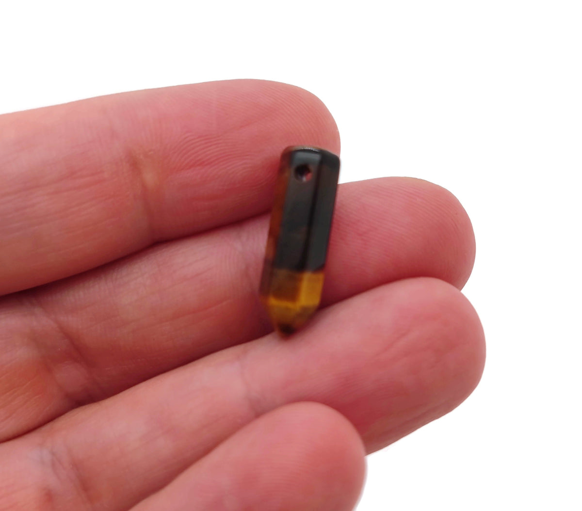 Tiger Eye crystal pendant with drilled point, showcasing the polished gemstone's rich brown and gold banding, by GemstoneGO.