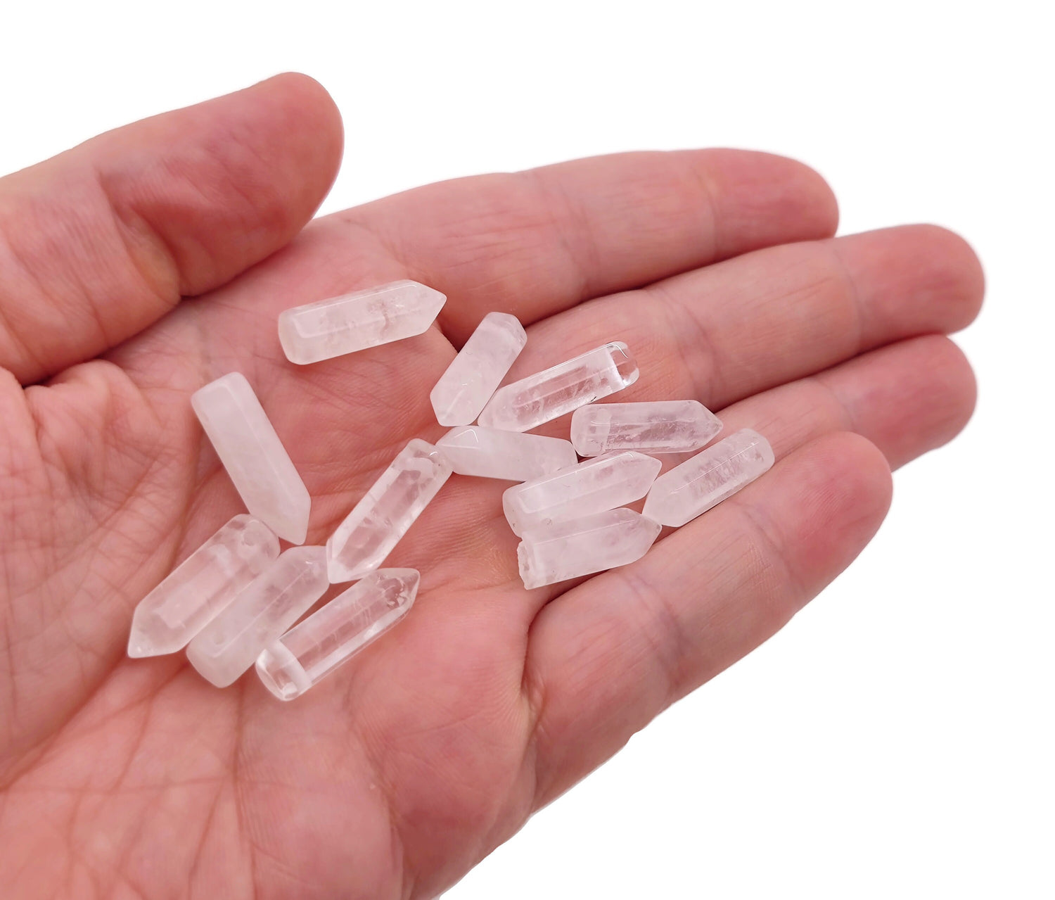 Clear quartz point crystal pendant with drilled hole, showcasing a polished, natural gemstone from GemstoneGO.