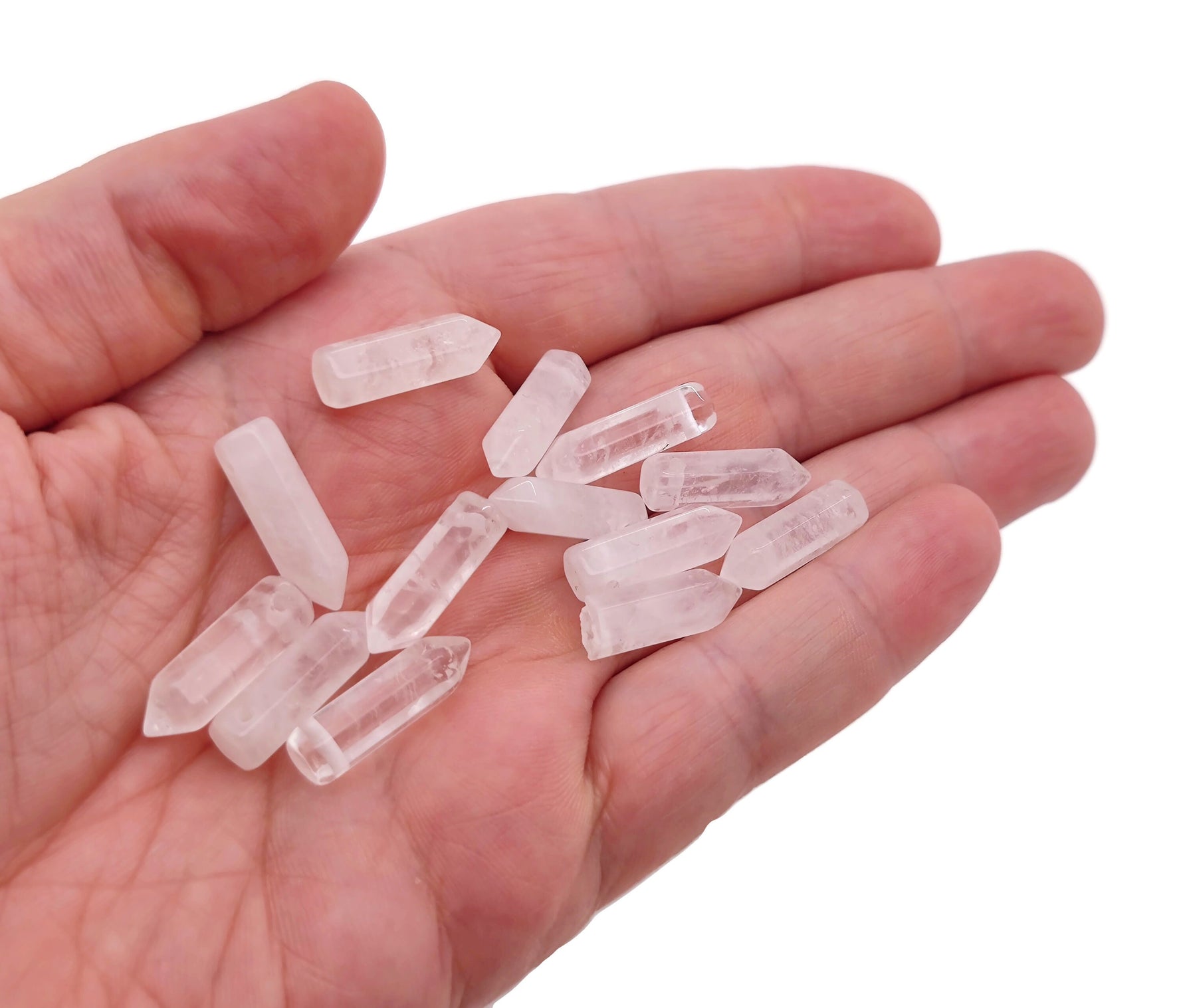 Clear quartz point crystal pendant with drilled hole, showcasing a polished, natural gemstone from GemstoneGO.