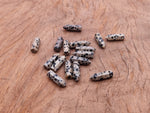 Dalmatian Jasper crystal point pendant with drilled hole, featuring black and cream spotted gemstone from GemstoneGO.
