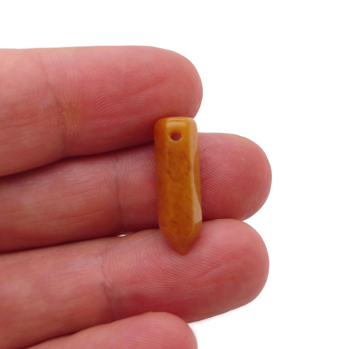 Yellow jade crystal pendant with drilled point, showcasing a vibrant, polished gemstone with natural color variations.