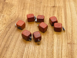 Red Jasper tumbled crystal pendant with silver bail from GemstoneGO, showcasing a smooth, polished red stone on a plain background.