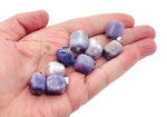 Lepidolite tumbled gemstone pendant from GemstoneGO featuring a smooth, polished purple stone with natural coloration and subtle variations.