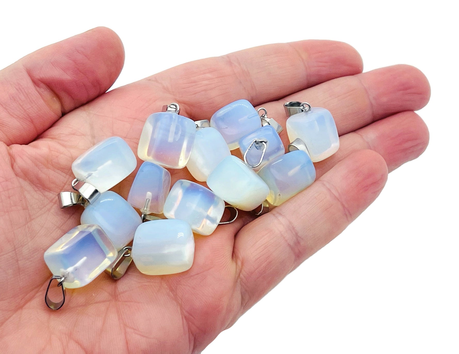 Opalite tumbled crystal pendant from GemstoneGO featuring a smooth, polished love stone with a subtle iridescent glow.