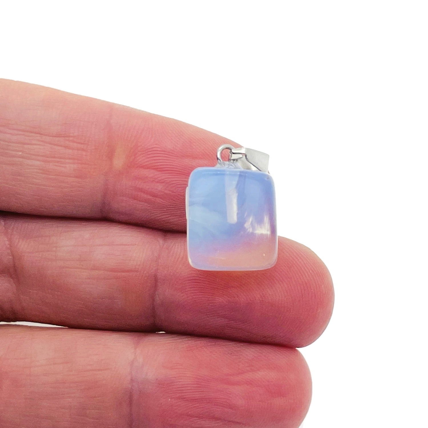 Opalite tumbled crystal pendant with love stone design from GemstoneGO, showcasing smooth, polished semi-precious gemstone jewelry.