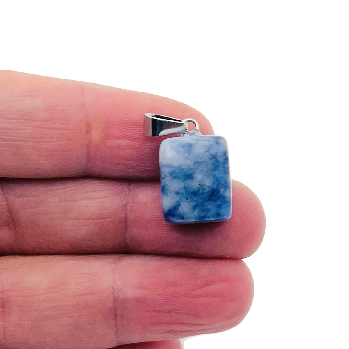 Blue Spot Jasper tumbled gemstone pendant from GemstoneGO, showcasing a polished crystal with vibrant blue spots and natural stone texture.