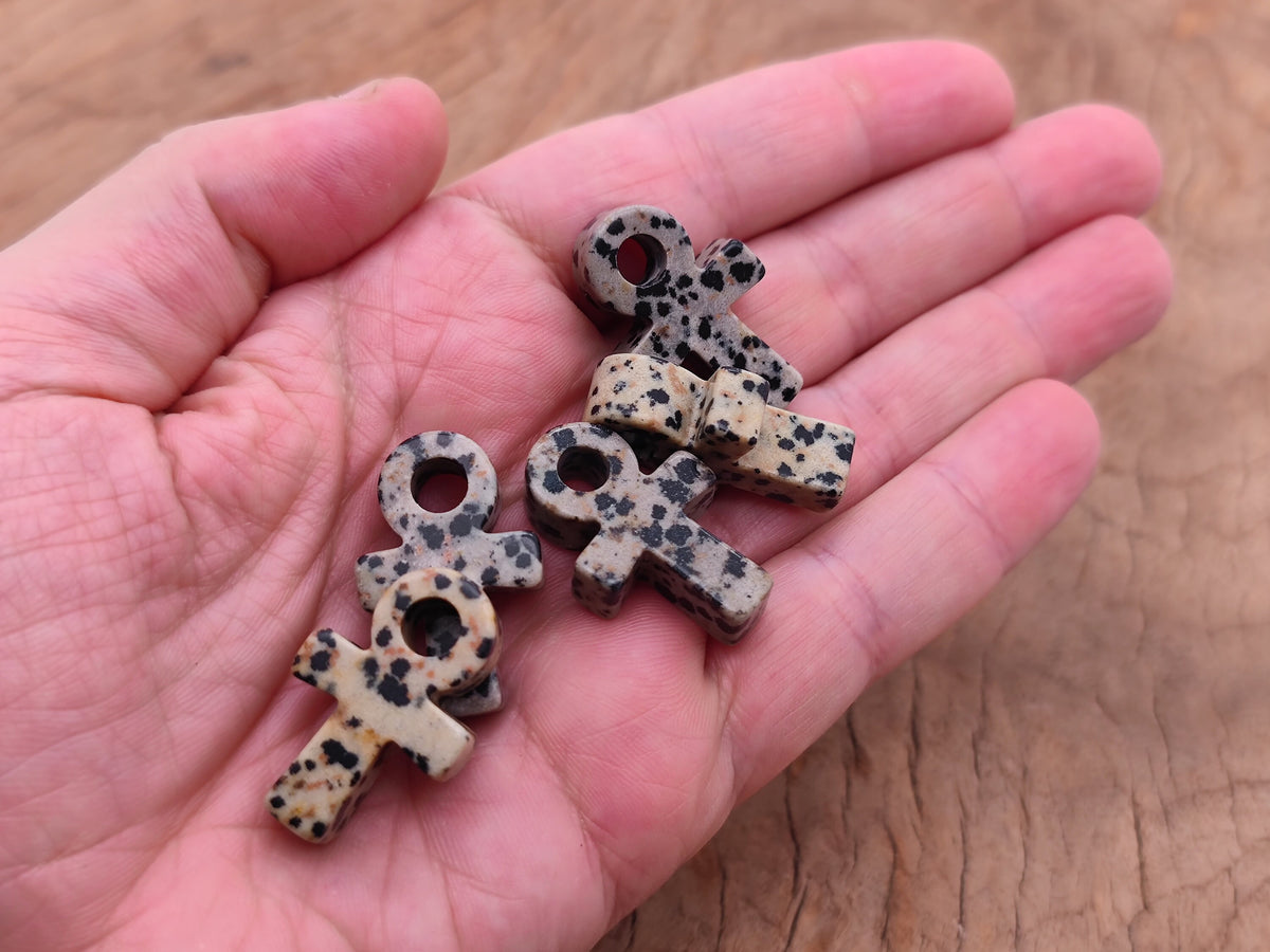 Dalmatian Jasper Anka crystal carving from GemstoneGO, 30mm gemstone ankhs with black spots and natural stone details.
