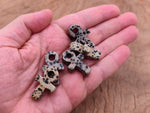Dalmatian Jasper Anka crystal carving from GemstoneGO, 30mm gemstone ankhs with black spots and natural stone details.