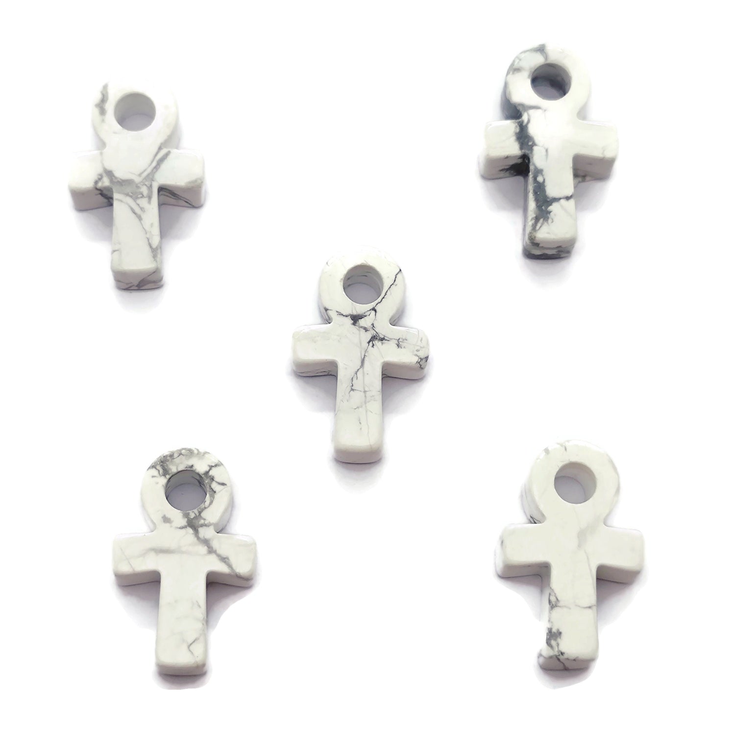 30mm Howlite Anka crystal carving featuring gemstone Ankh design, crafted by GemstoneGO, displayed on a neutral background.