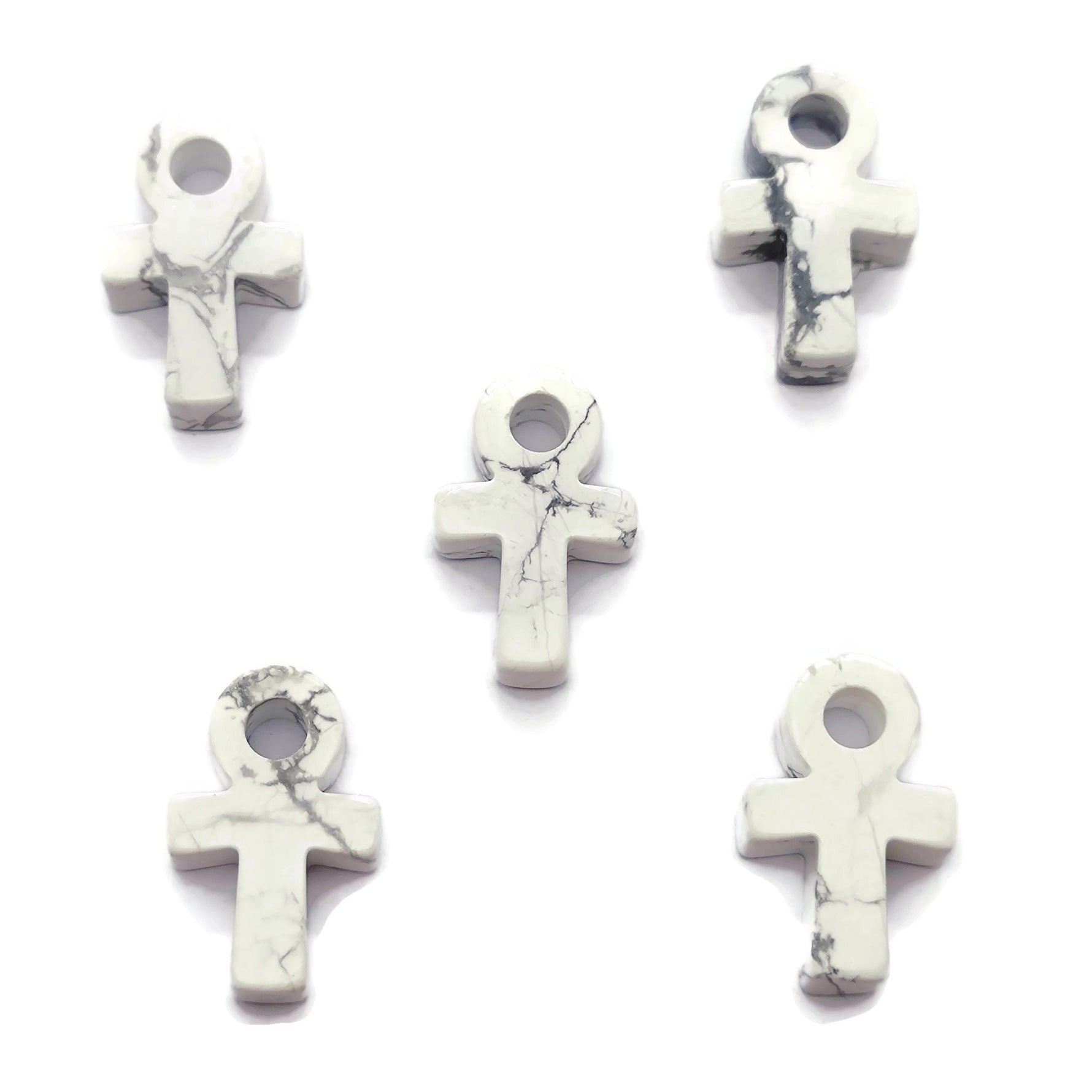 30mm Howlite Anka crystal carving featuring gemstone Ankh design, crafted by GemstoneGO, displayed on a neutral background.