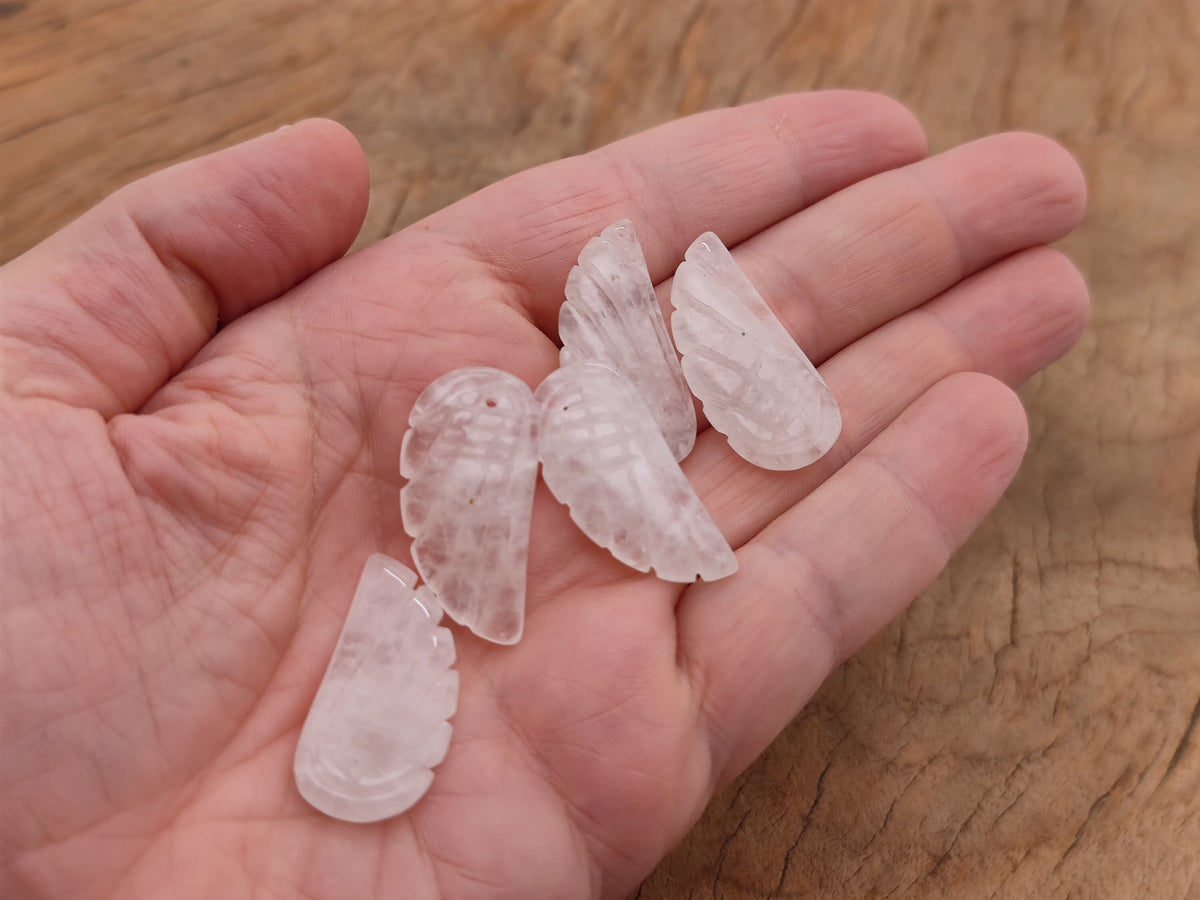Clear quartz angel wing crystal pendant with hole charm, featuring detailed angel wing design, by GemstoneGO.