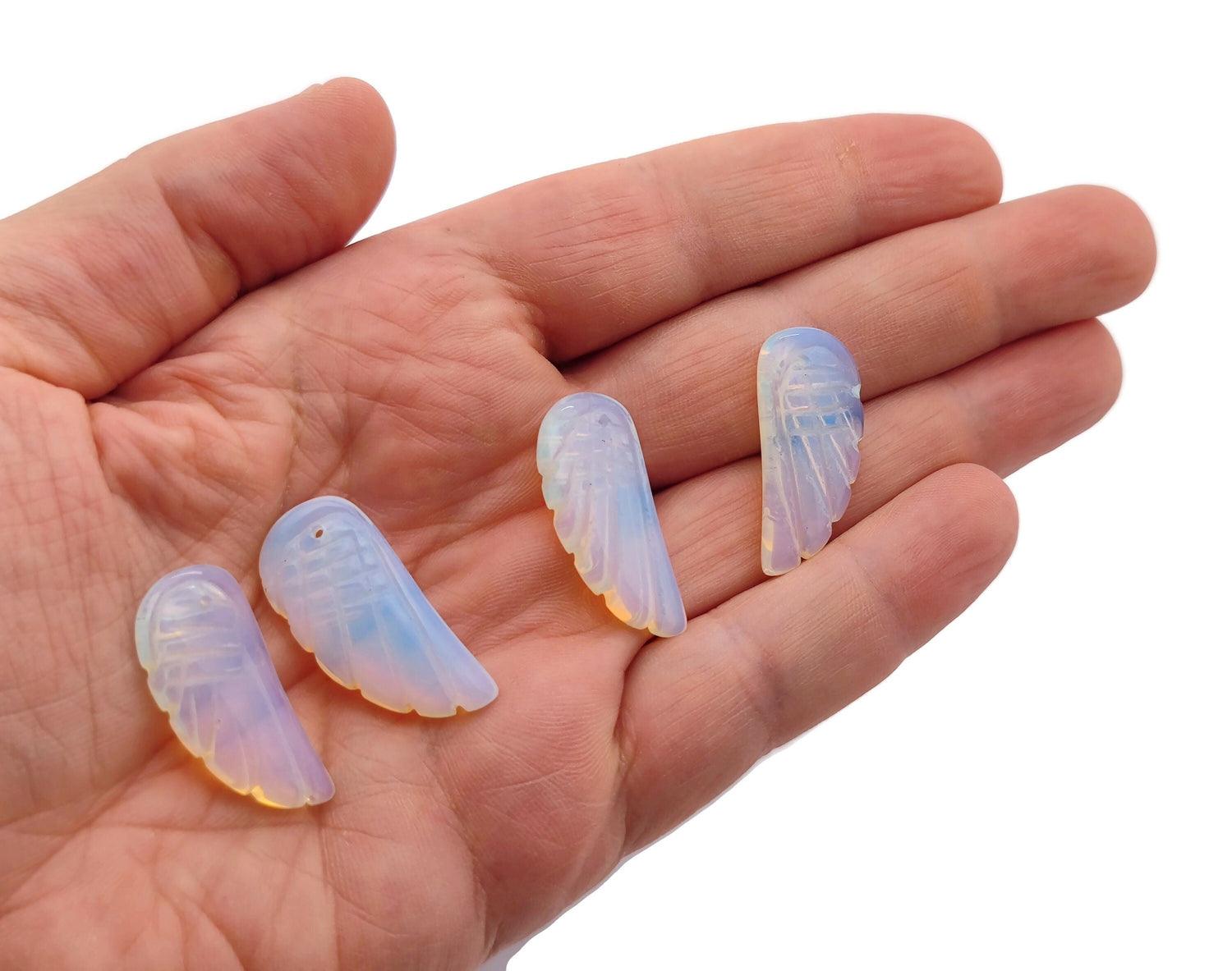 Opalite angel wing crystal pendant with hole charm from GemstoneGO, showcasing a delicate angel wing design in a polished crystal.