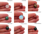Round crystal ball pendant from GemstoneGO, perfect for jewelry making, showcasing a clear, polished gemstone sphere.