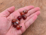 Carnelian crystal ball pendant by GemstoneGO, round gemstone jewelry making pendant with polished orange-red stone.