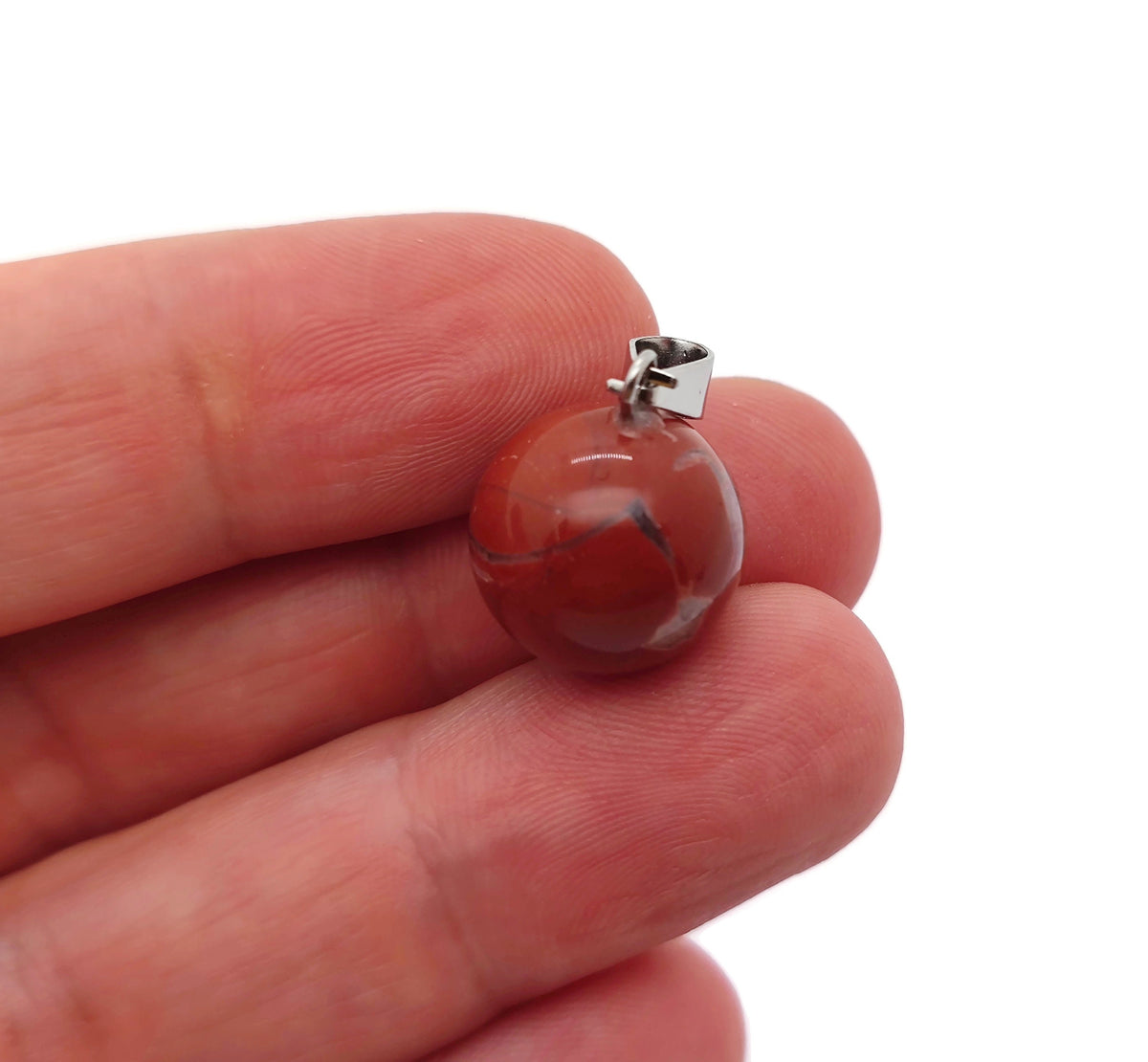 Red Jasper crystal ball pendant from GemstoneGO featuring a smooth round shape, perfect for jewelry making and accessories.