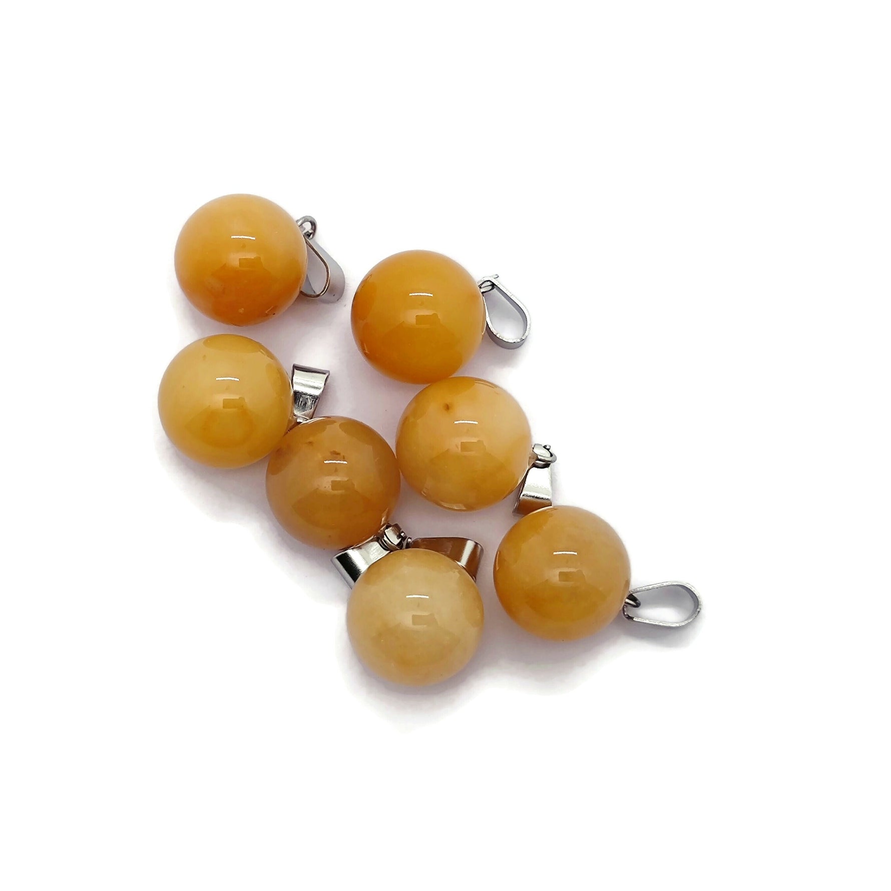 Yellow jade ball crystal pendant for jewelry making, featuring a round gemstone with a smooth polished surface.