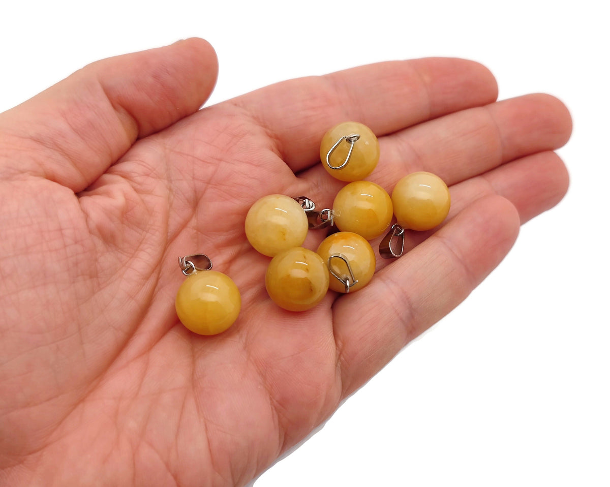 Yellow jade ball crystal pendant from GemstoneGO, round gemstone jewelry making pendant with polished yellow jade sphere.