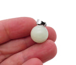 Luminous crystal round ball pendant for jewelry making, featuring a clear, shiny gemstone from GemstoneGO.