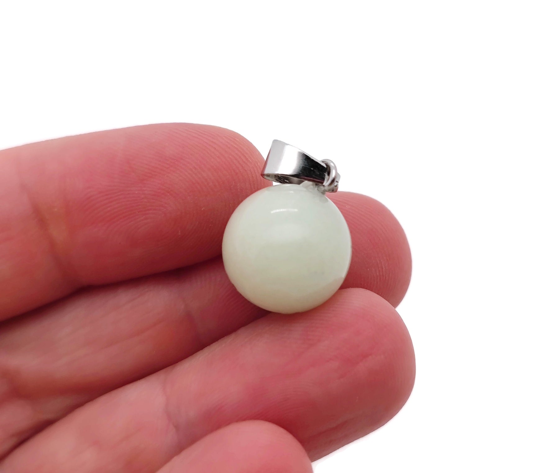 Luminous crystal round ball pendant for jewelry making, featuring a clear, shiny gemstone from GemstoneGO.