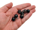Black agate crystal ball pendant for jewelry making, round gemstone with smooth polished surface and silver bail attachment.