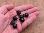 Black agate crystal ball pendant with smooth round shape, gemstone jewelry making accessory from GemstoneGO.