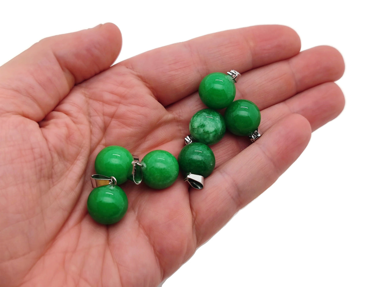 Green Agate crystal ball pendant from GemstoneGO, smooth round gemstone suitable for jewelry making and decorative crafts.