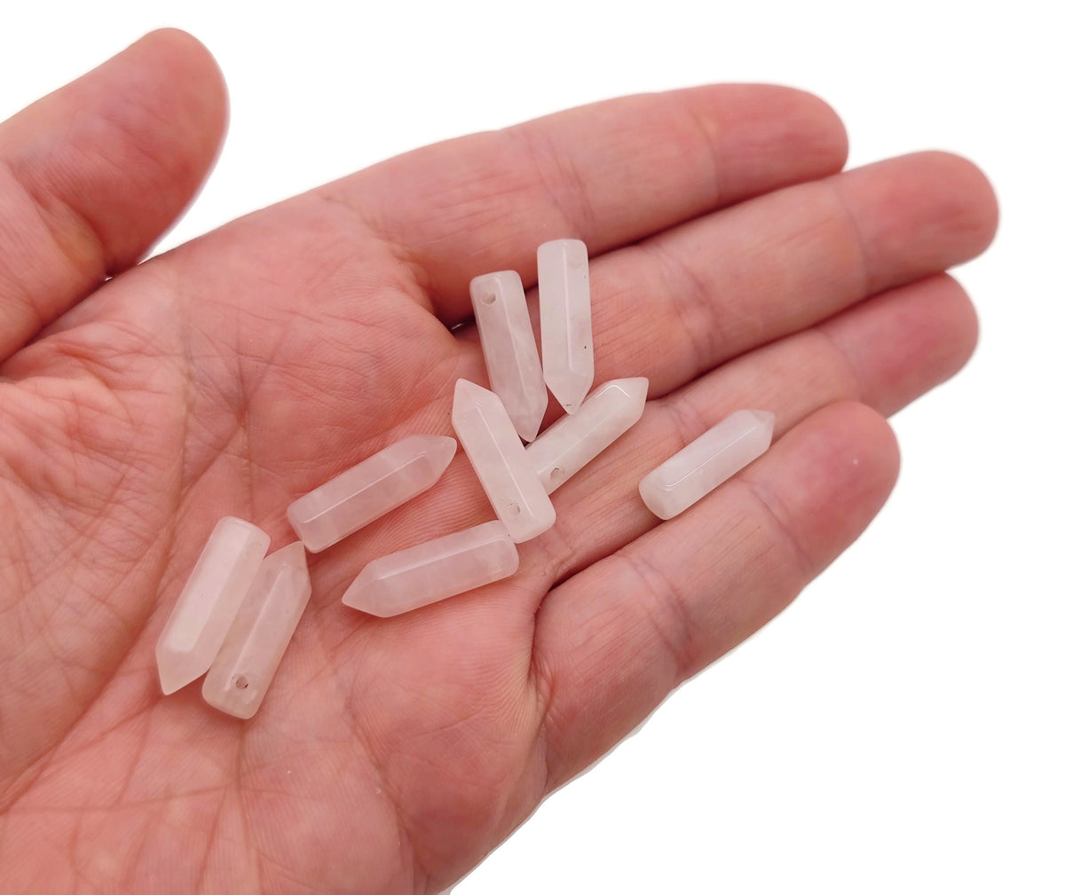 Rose Quartz point crystal pendant from GemstoneGO featuring a drilled crystal gemstone with a natural pink hue.