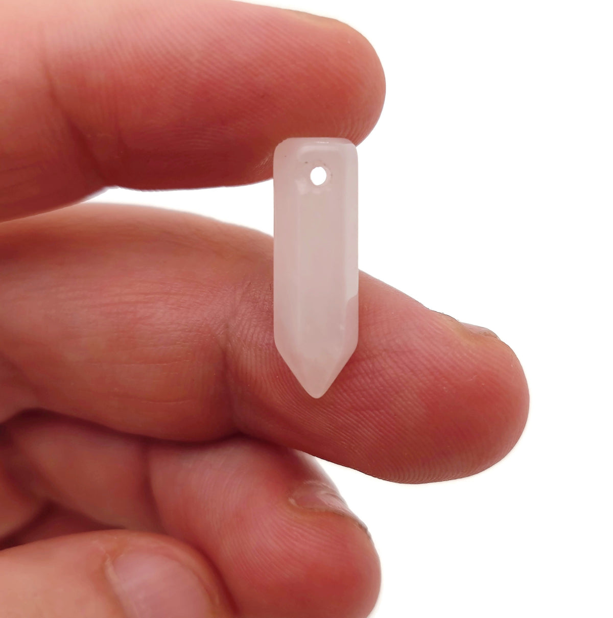 Rose quartz point crystal pendant with drilled hole, showcasing a polished gemstone from GemstoneGO.