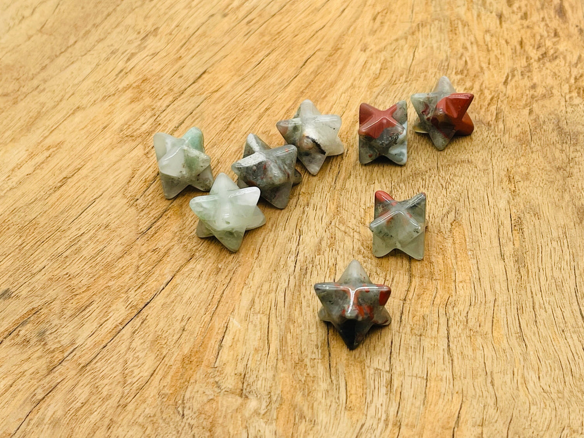 13mm African Bloodstone Merkaba Star crystal from GemstoneGO, used for Reiki healing and energy work.