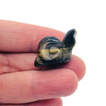 Handmade 30mm gemstone crystal snail animal figure with carved details, crafted by GemstoneGO, in a colorful mix of stones.