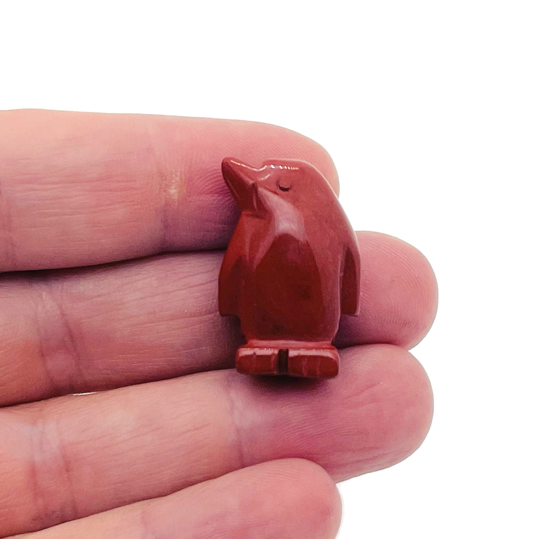 Handmade 30mm gemstone crystal penguin animal figure by GemstoneGO, carved with detailed features and a smooth polished finish.