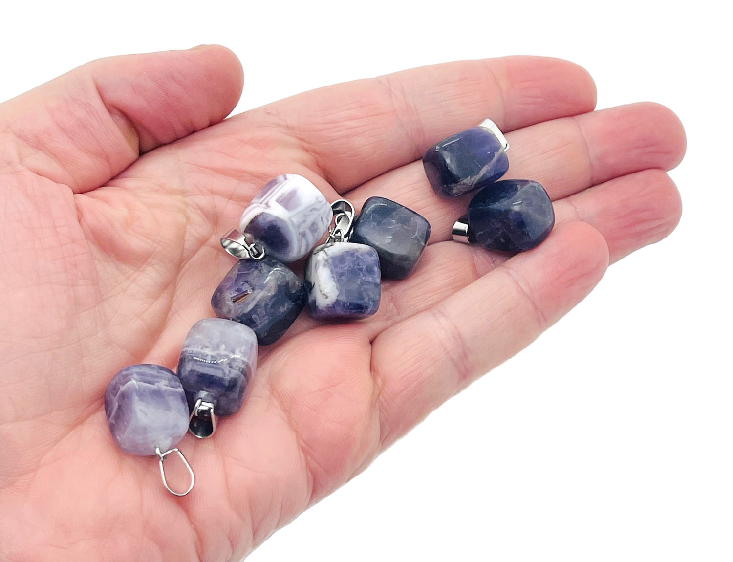 Amethyst tumbled gemstone pendant from GemstoneGO featuring a smooth purple stone with natural variations and a silver bail.