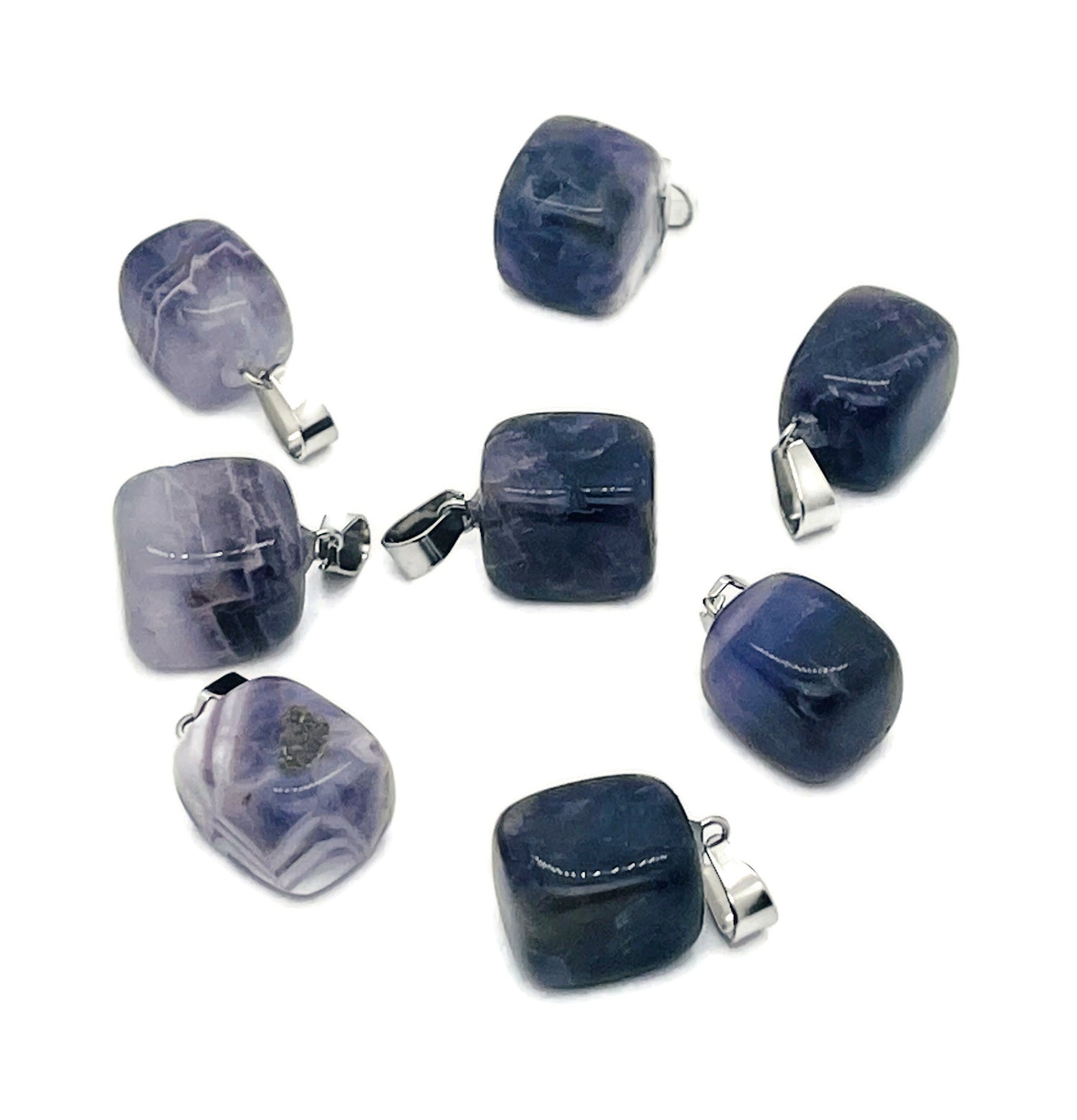 Amethyst tumbled gemstone pendant from GemstoneGO featuring a smooth purple stone with natural variations and a silver bail.