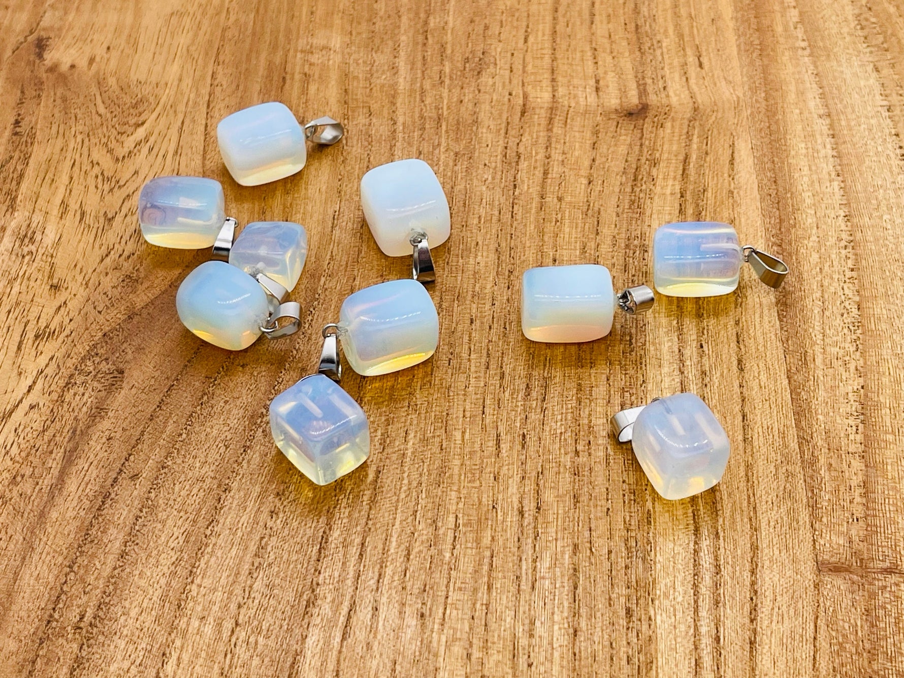 Opalite tumbled crystal pendant from GemstoneGO, featuring a smooth love stone with a polished, rounded appearance.