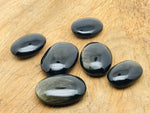 Golden sheen obsidian palm gemstone spa stone from GemstoneGO, showcasing a smooth, polished black and gold-toned healing stone.