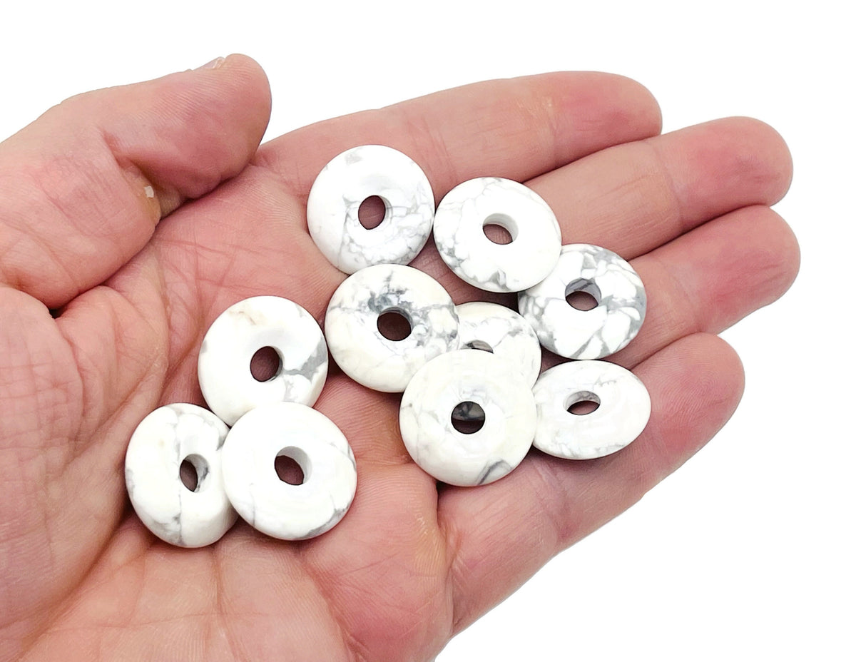 Howlite crystal donut pendant from GemstoneGO, 20mm Pi stone with white and gray marbled appearance, smooth round shape.