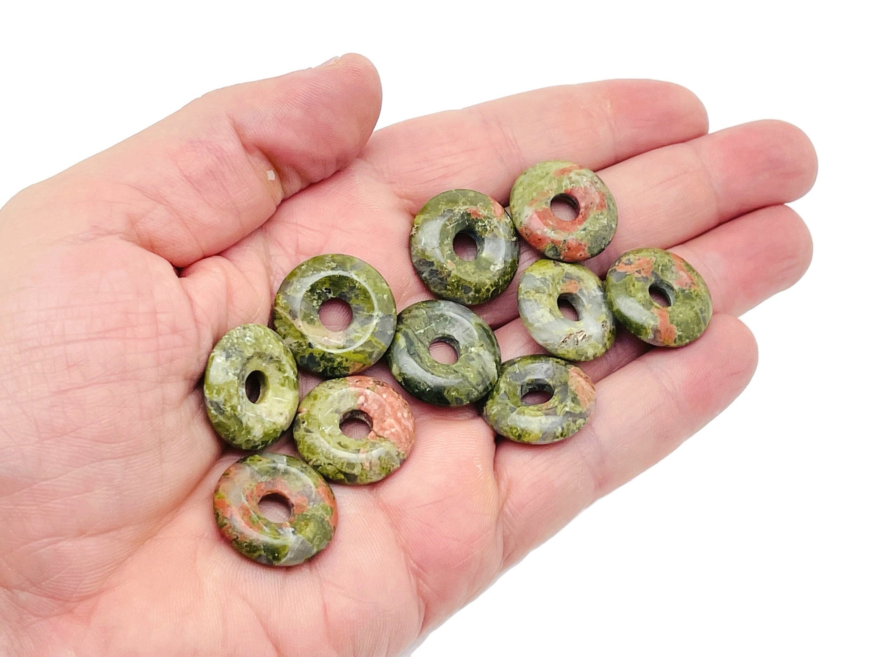 Unakite crystal donut pendant, 20mm Pi stone from GemstoneGO, showcasing vibrant green and pink mineral patterns.