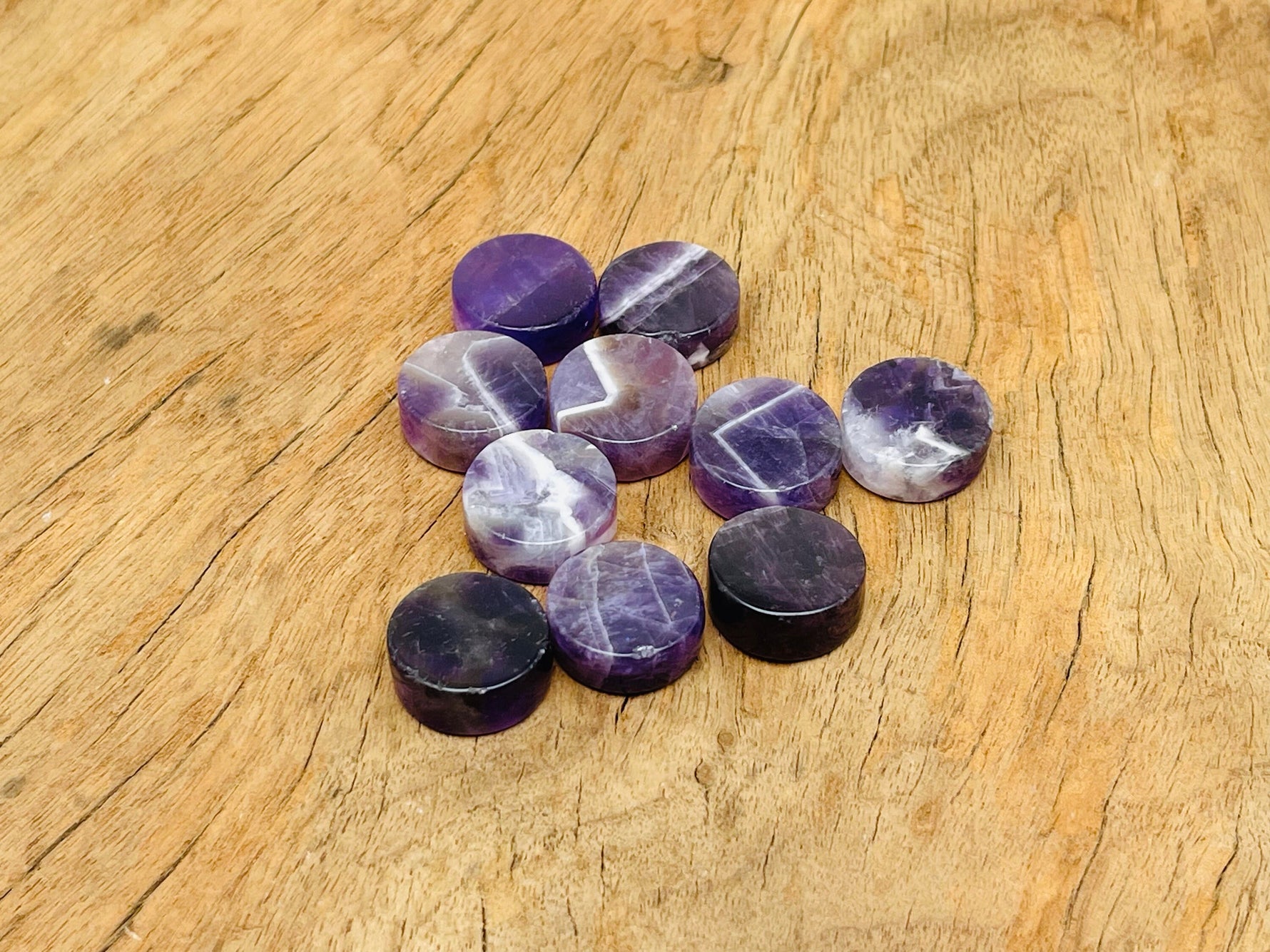 Round amethyst flat gemstone slab from GemstoneGO, showcasing vibrant purple crystal with smooth polished surface.