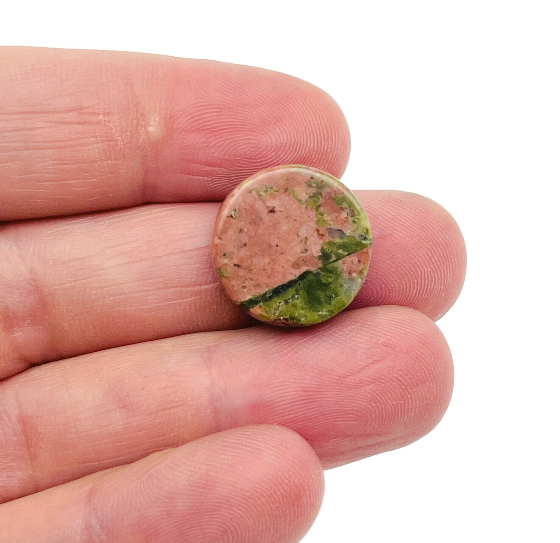Round Unakite flat gemstone slab, vibrant green and pink crystal, showcasing smooth polished surface and natural mineral patterns.