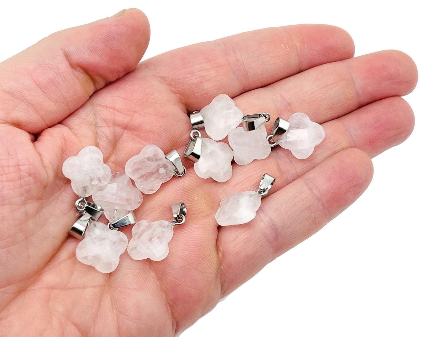 Clear quartz four-leaf clover crystal pendant from GemstoneGO, ideal for DIY jewelry making, showcasing a detailed gemstone design.