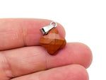 Red Jasper four-leaf clover crystal pendant for jewelry making by GemstoneGO, featuring vibrant red stone and detailed craftsmanship.