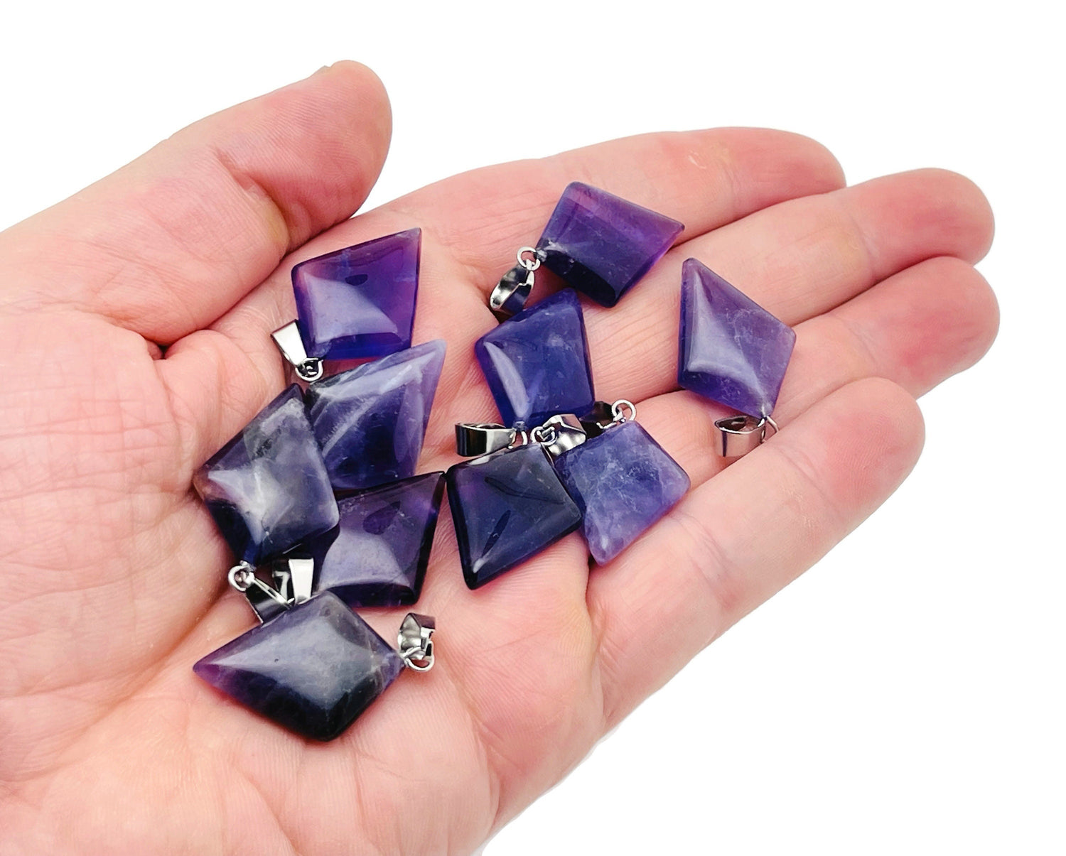 Amethyst triangle gemstone pendant with geometric design by GemstoneGO, showcasing a vibrant purple amethyst stone and silver setting.
