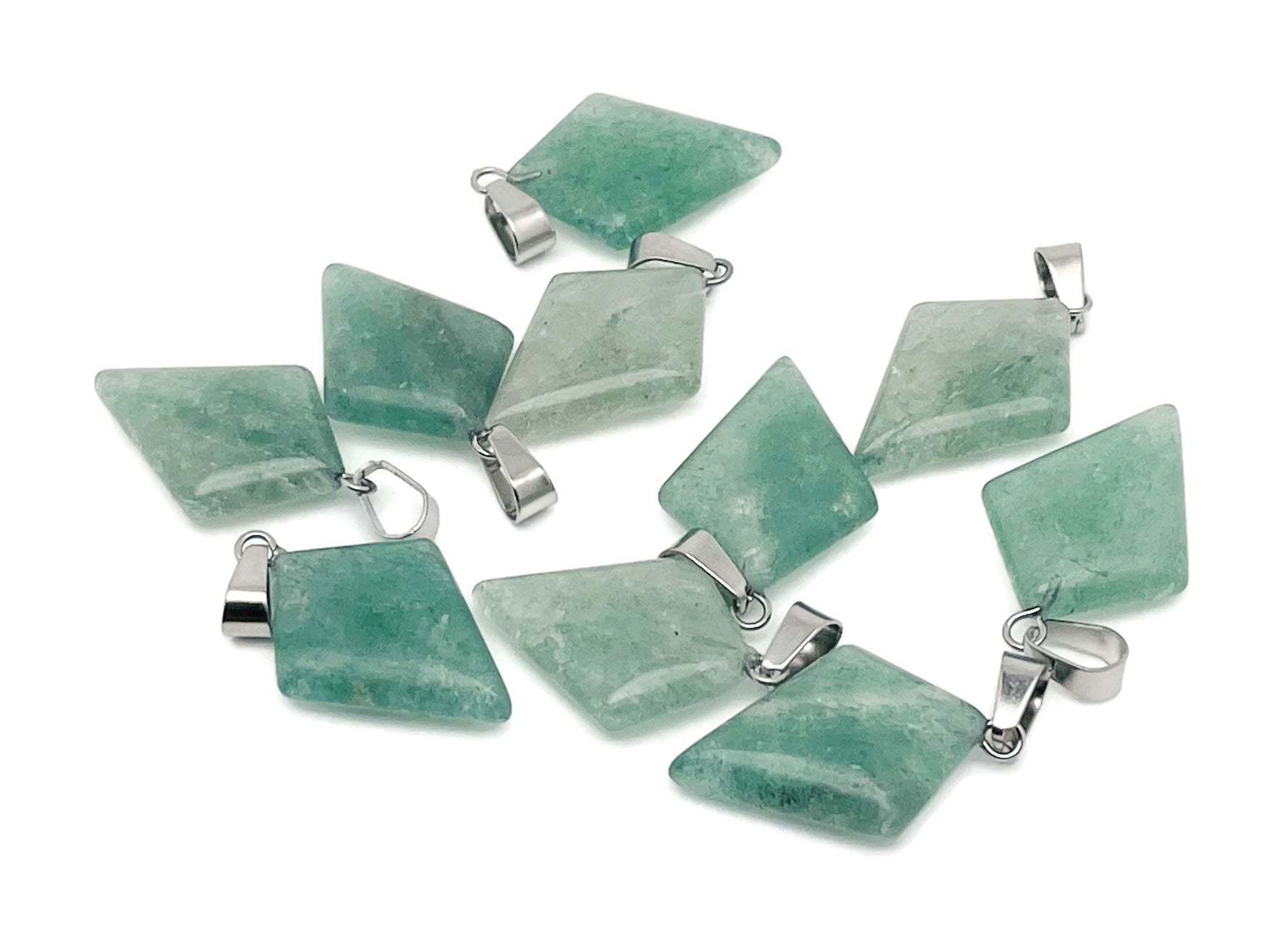Green strawberry quartz triangle gemstone pendant with geometric design, showcasing vibrant green color and polished surface.