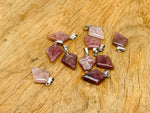 Strawberry Quartz triangle gemstone pendant from GemstoneGO, showcasing a geometric red-pink gemstone on a silver chain.