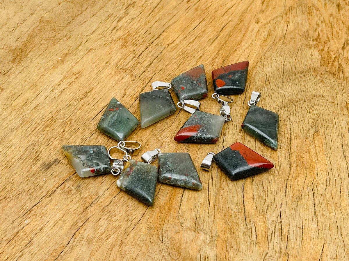 African Bloodstone triangle gemstone pendant featuring a geometric design, showcasing deep green and red hues, by GemstoneGO.