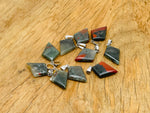 African Bloodstone triangle gemstone pendant featuring a geometric design, showcasing deep green and red hues, by GemstoneGO.