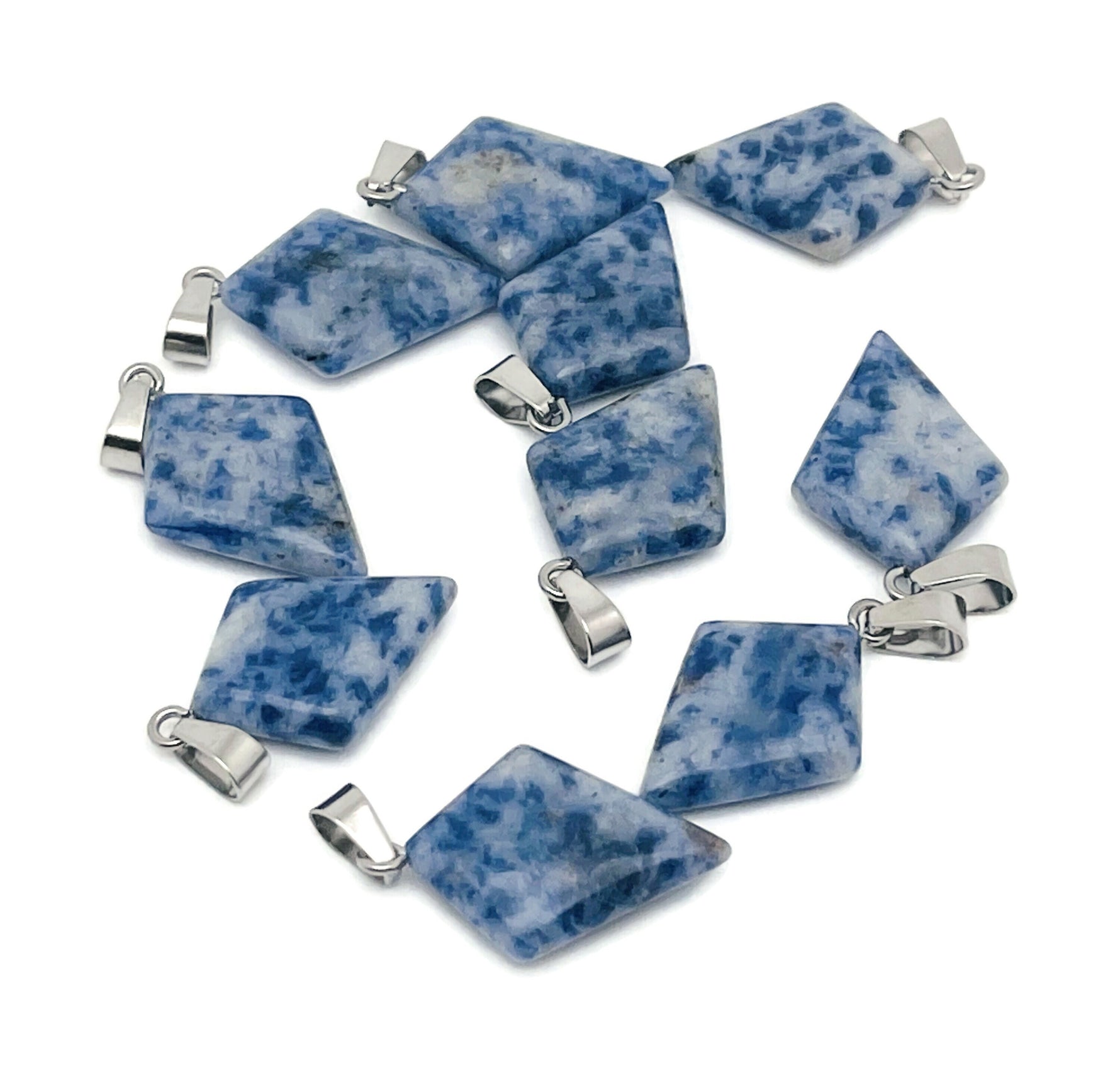 Blue Spot Jasper triangle gemstone pendant from GemstoneGO featuring a geometric design and vibrant blue and black spots.