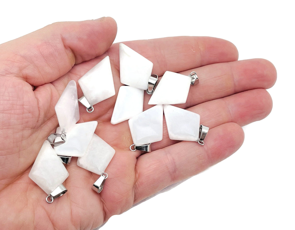 White jade triangle gemstone pendant with geometric design, crafted by GemstoneGO, featuring a smooth, polished surface and elegant shape.