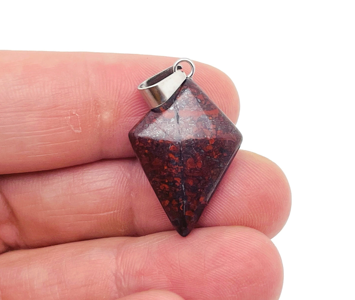Chicken Bloodstone Jasper triangle pendant featuring a geometric gemstone design, showcasing rich red and green hues.